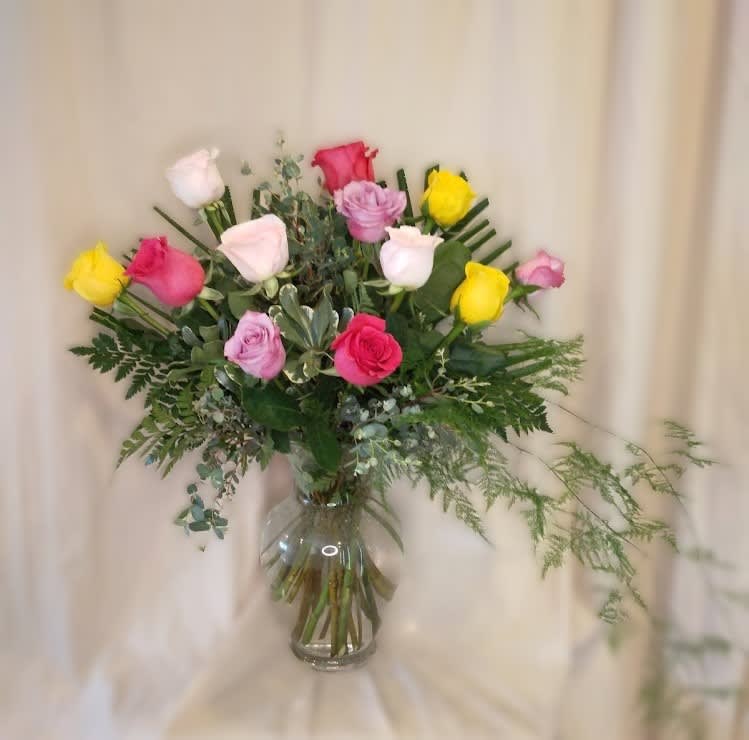 Premium one dozen multi-colored roses ~ absolutely beautiful arranged in clear glass