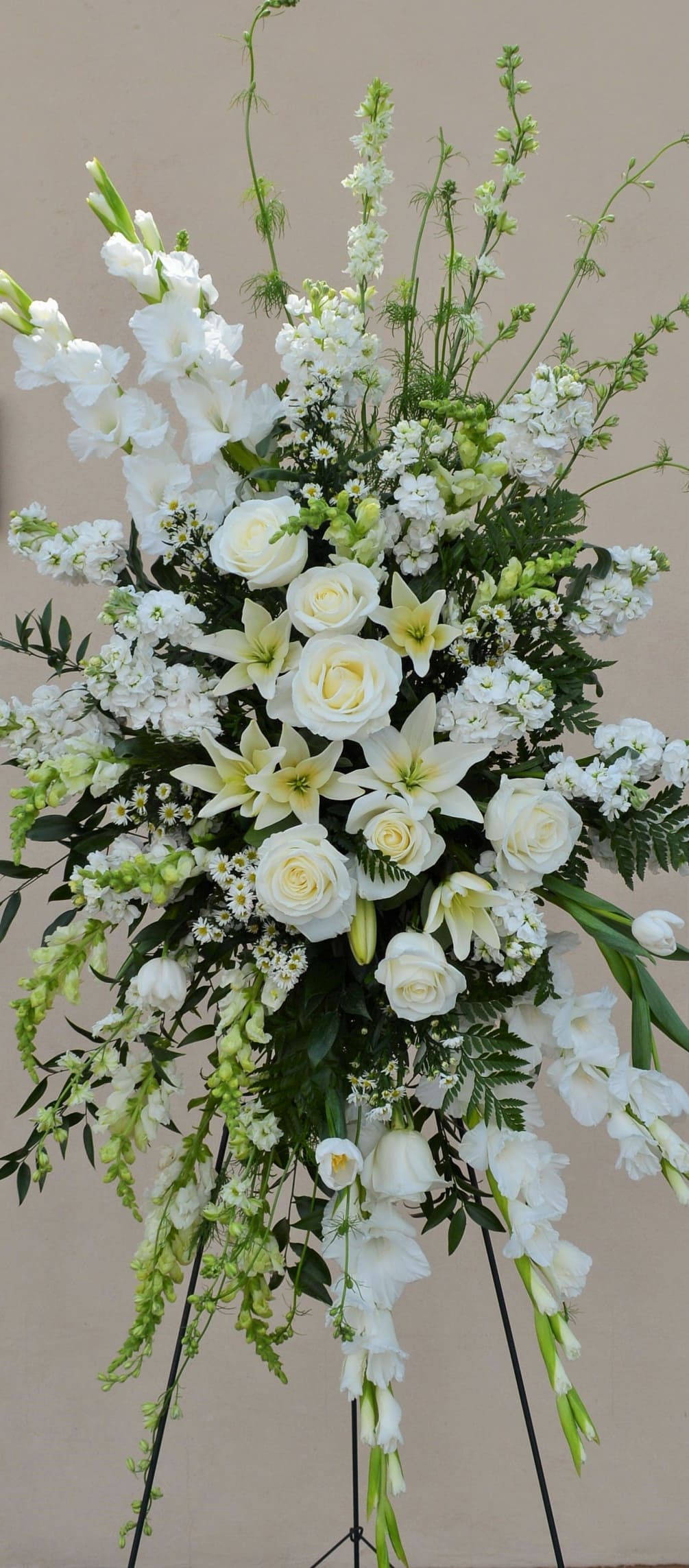 A classic combination of high quality blooms, roses, lilies, stock and gladiolas