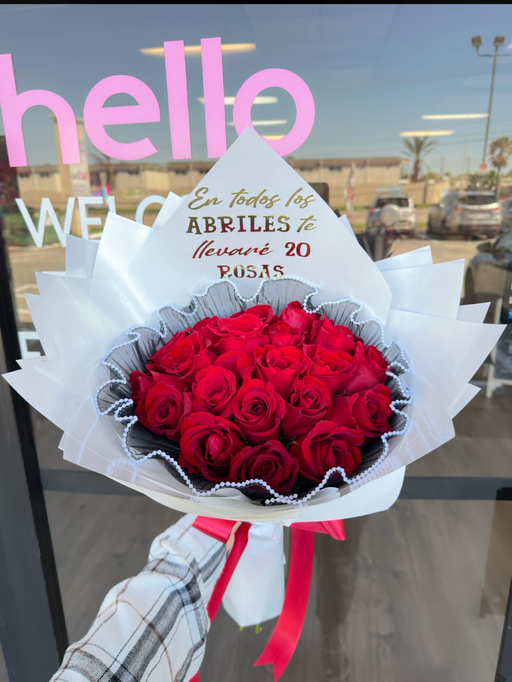 A medium sized bouquet of roses with vinyl lettering. 
