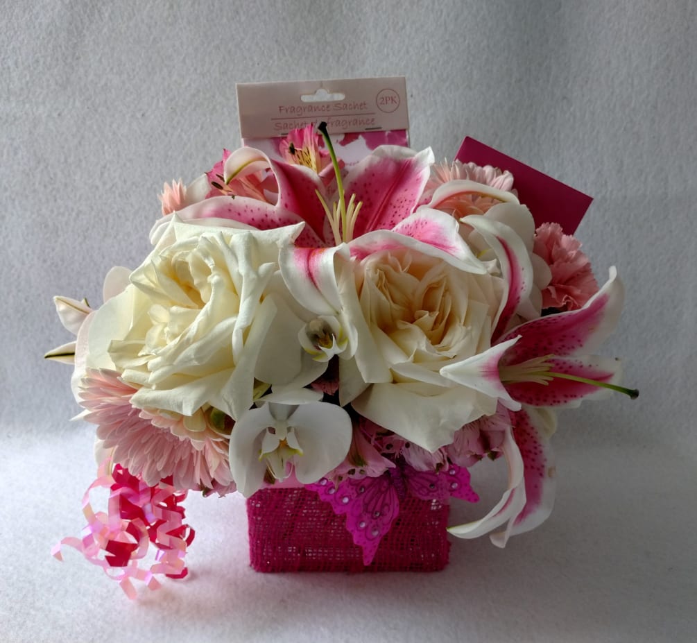 Send this pink blossoms beauty with it&#039; roses and more arranged in
