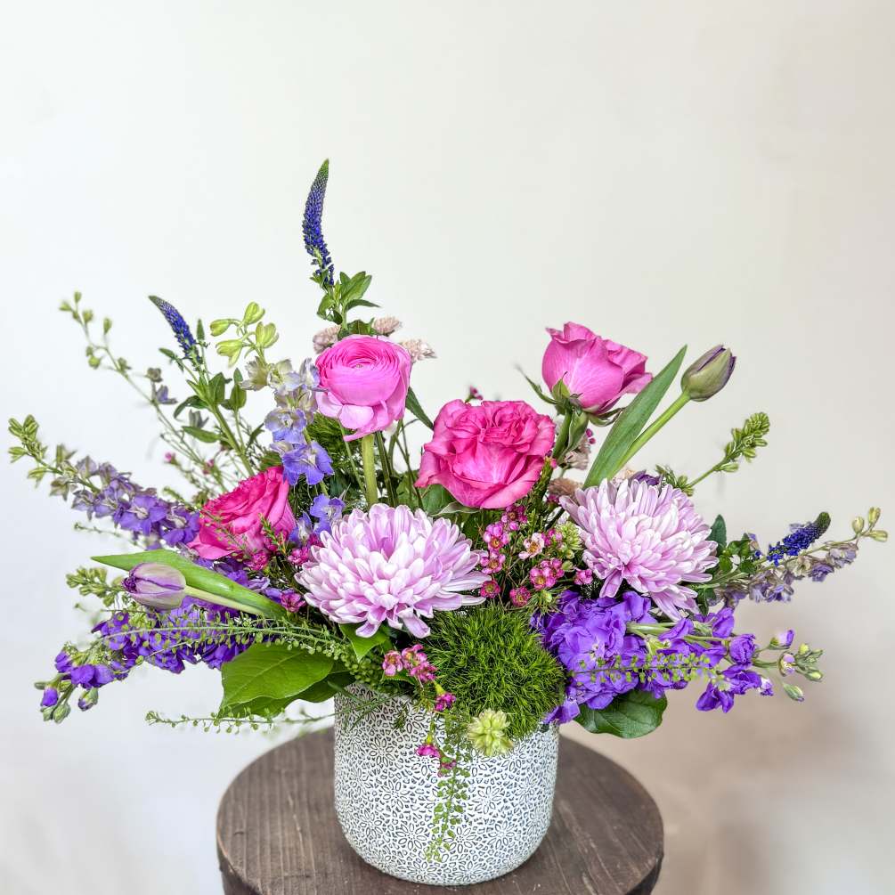 A bold blend of the season&#039;s best blooms in a ceramic container