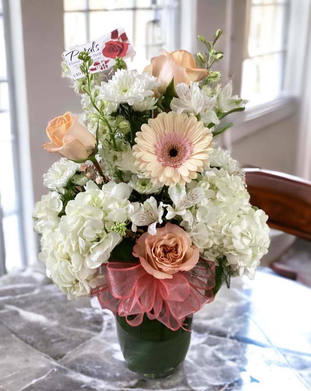 This bouquet is a Summer delight, designed with fluffy mounds of white