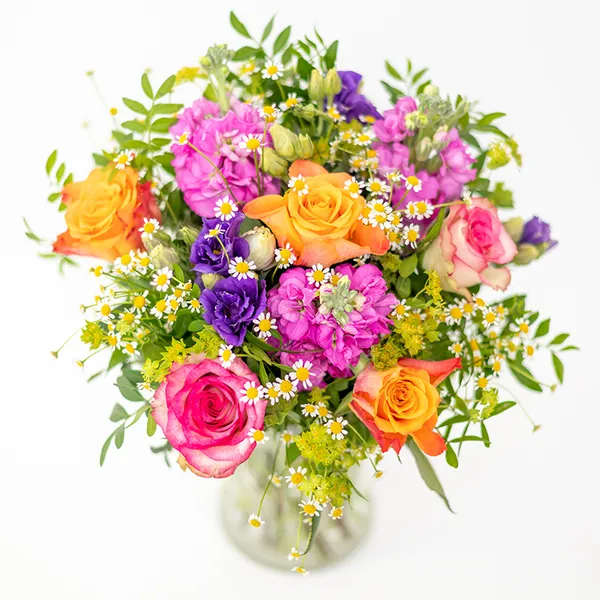 Like freshly picked from a lush flower garden. This sweet floral arrangement