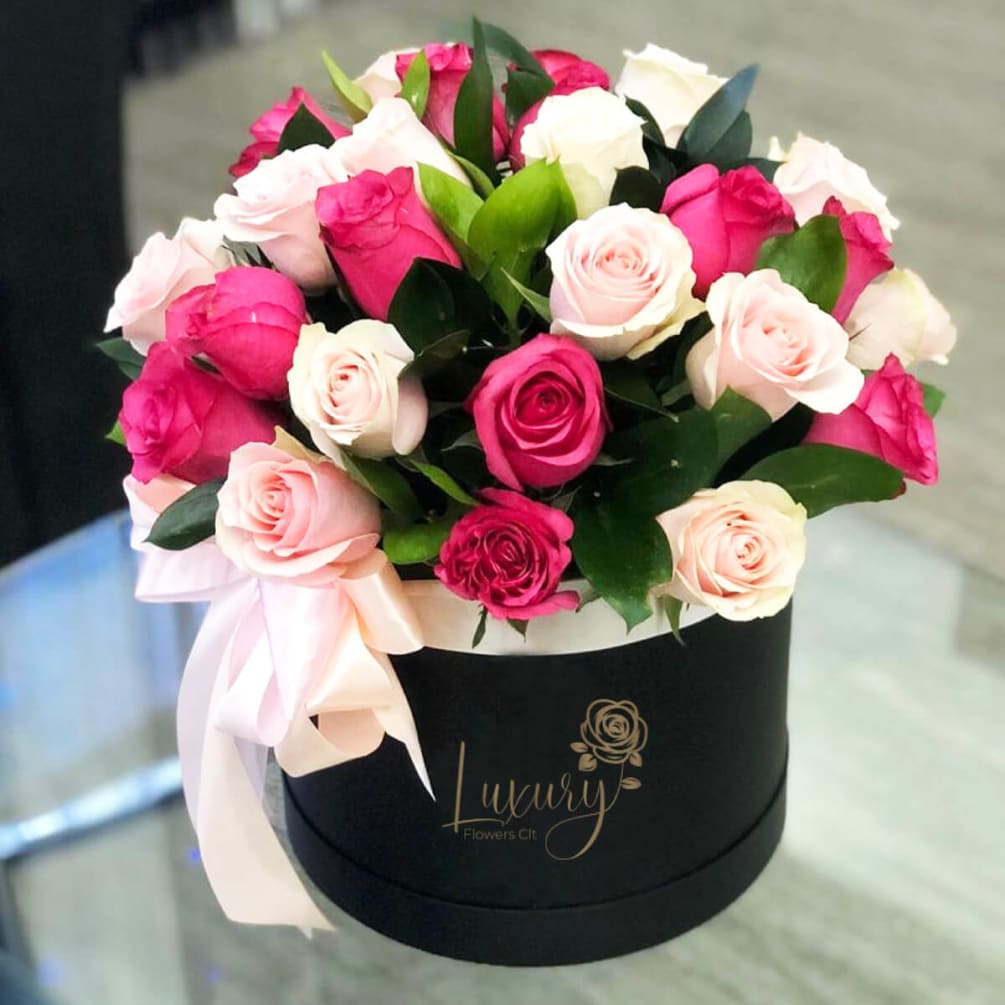 Our exclusive design of fresh roses in the beautiful box is a