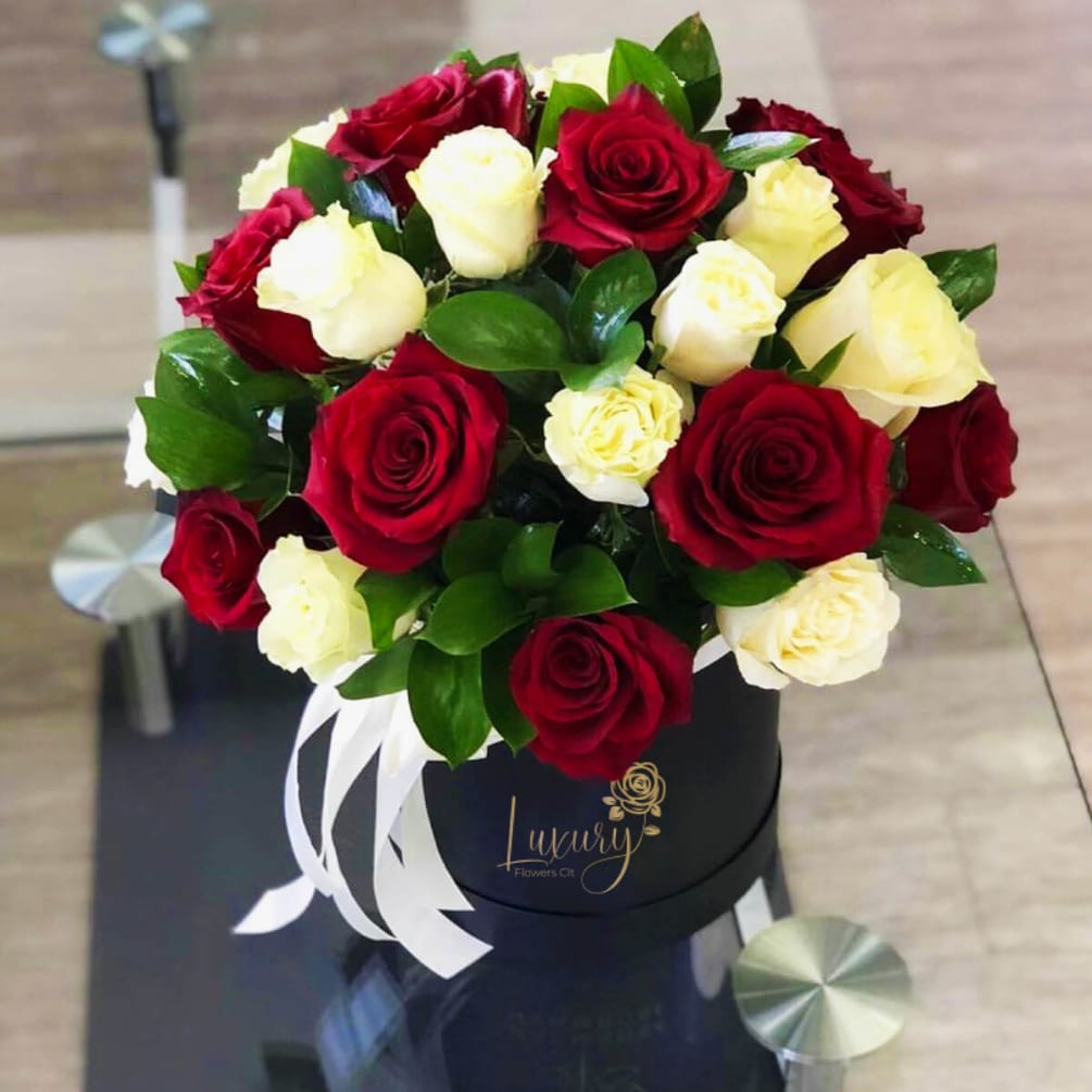 Our exclusive design of fresh flowers in a beautiful box is a