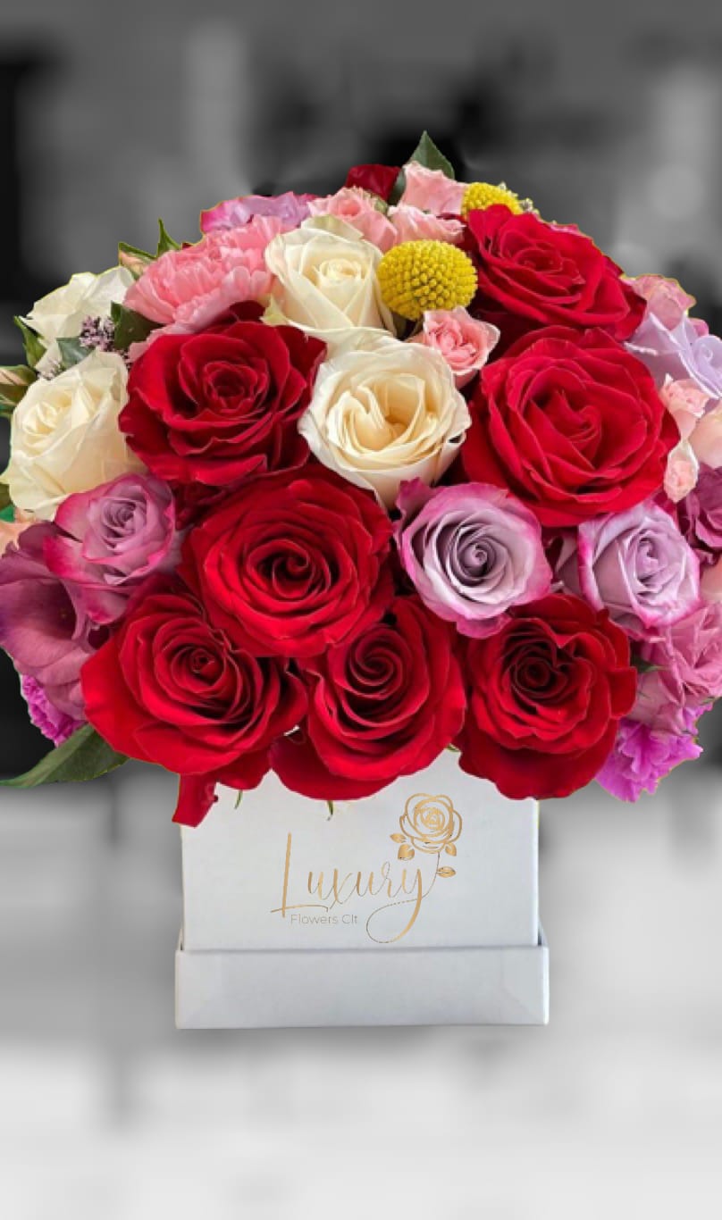 Our exclusive designs of fresh flowers in the beautiful queen box are