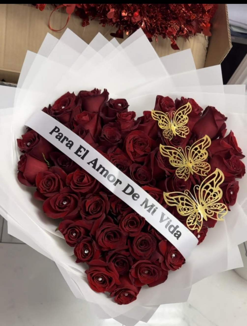 This bouquet comes with 50 red Ecuadorian long stem roses. Sash and