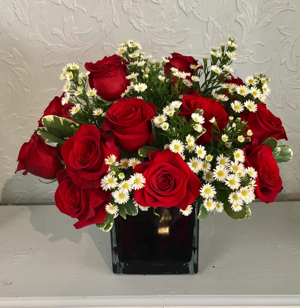 Here we have 12 Beautiful, Premium Red Roses arranged  by Tall