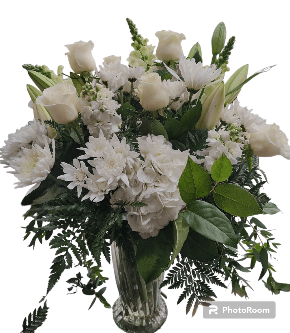 Beautiful all white vase arrangement with higher end flowers. Perfect for any