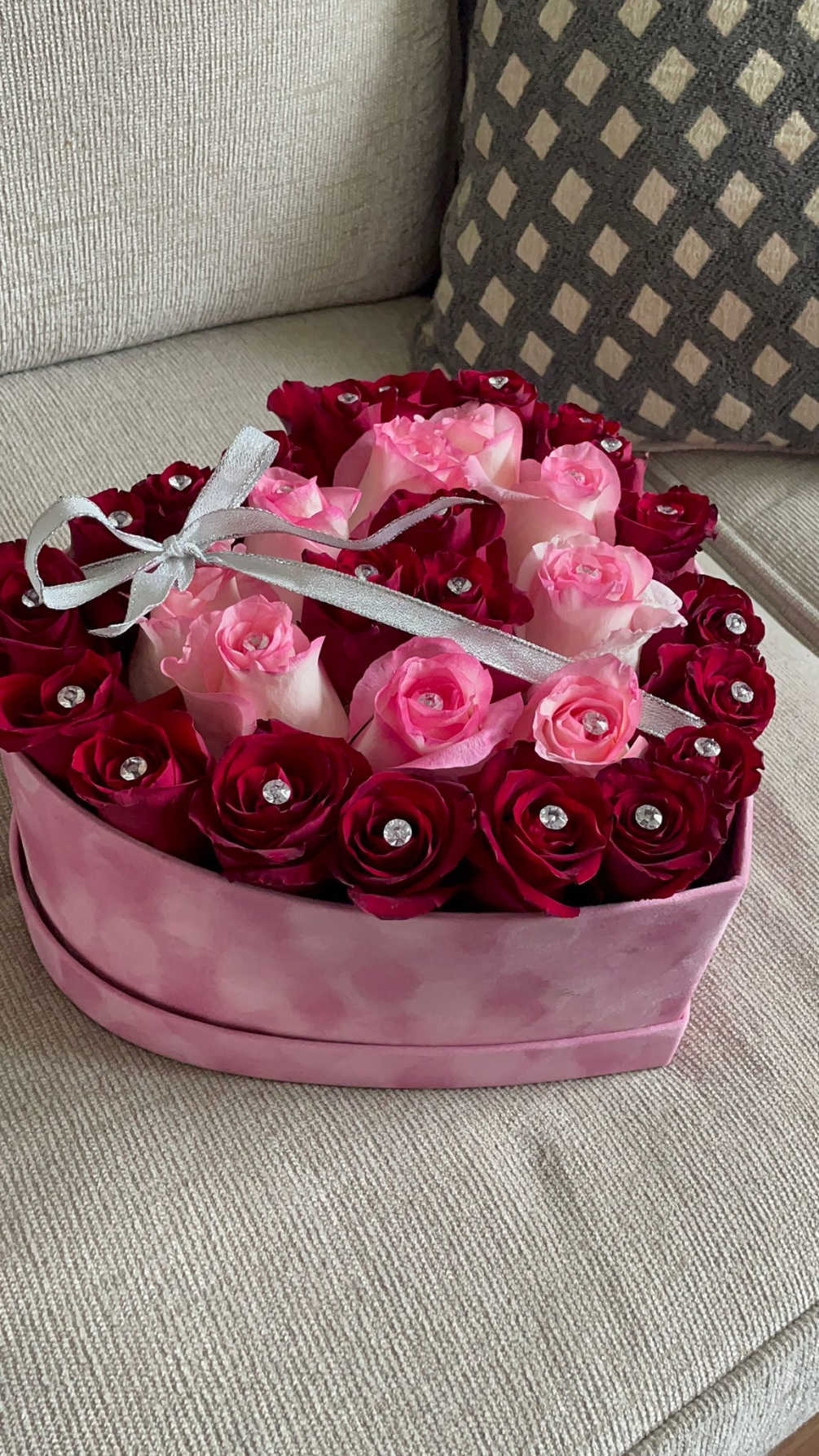 Romantic roses in a heart shaped velvet box. 