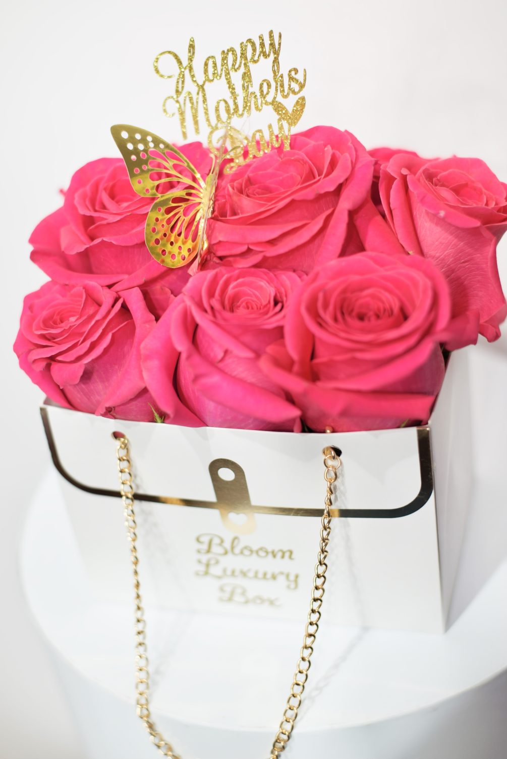 Our luxury hand bag arrangement, 1 dozen  pink  roses, hand