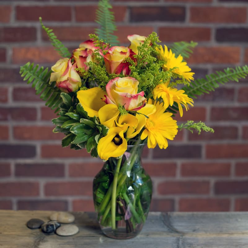 Yellow mini calla lilies, yellow roses, yellow asters