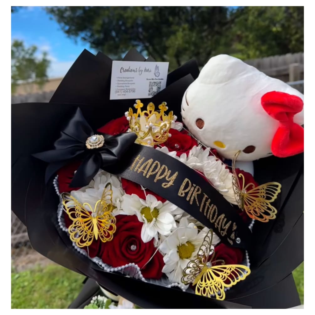 This bouquet includes Hello Kitty plush, red roses, white daisies, Custom Message