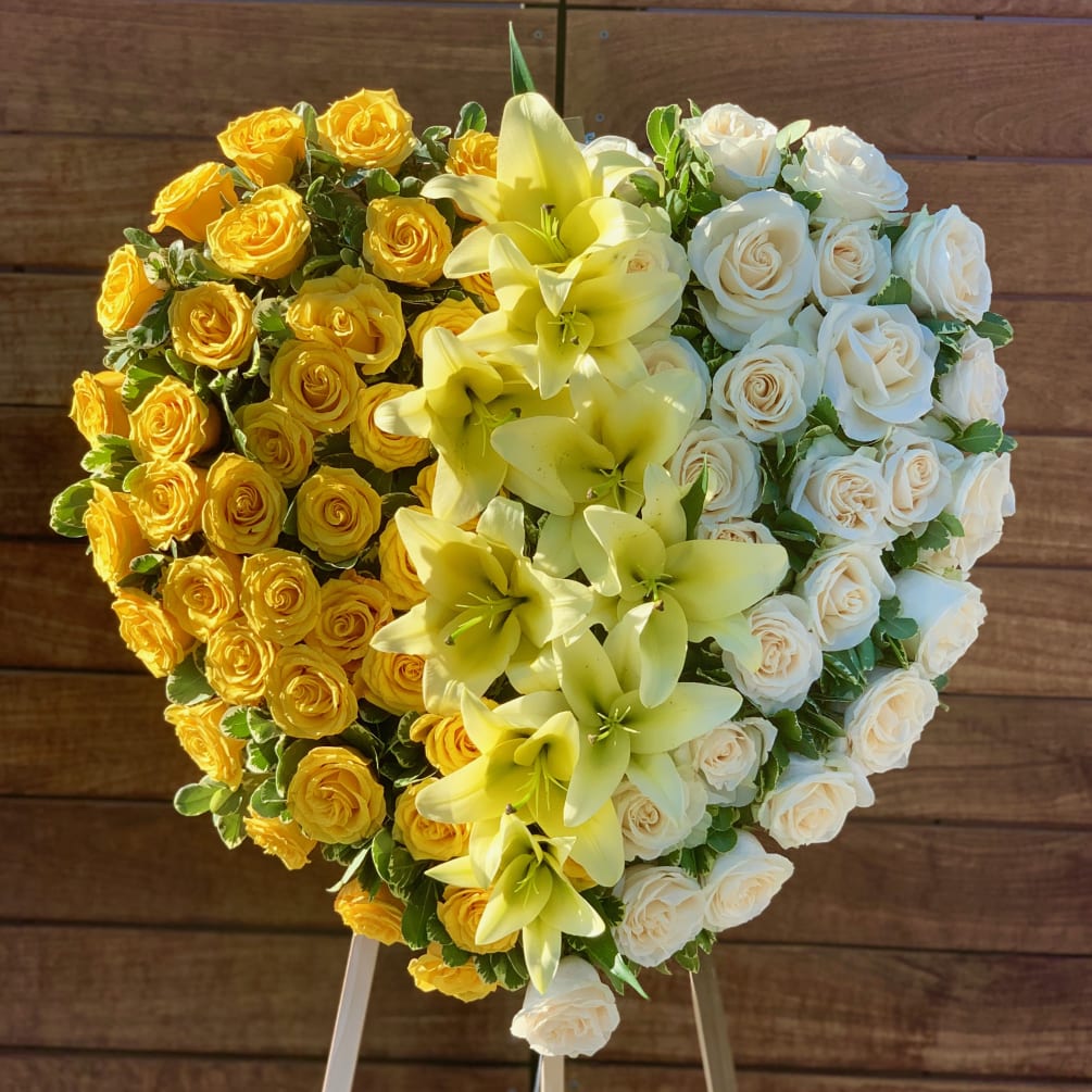 This perfect one of a kind heart shaped arrangement consists of big