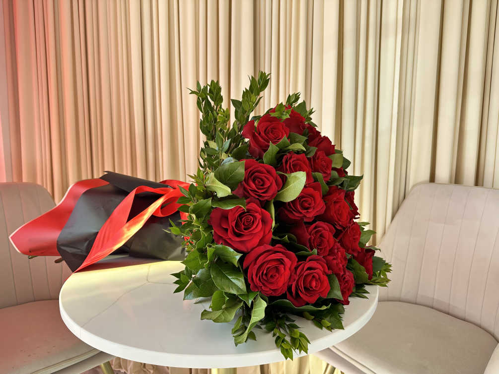 Celebrate a momentous occasion with this breathtaking bouquet of 25 fiery red