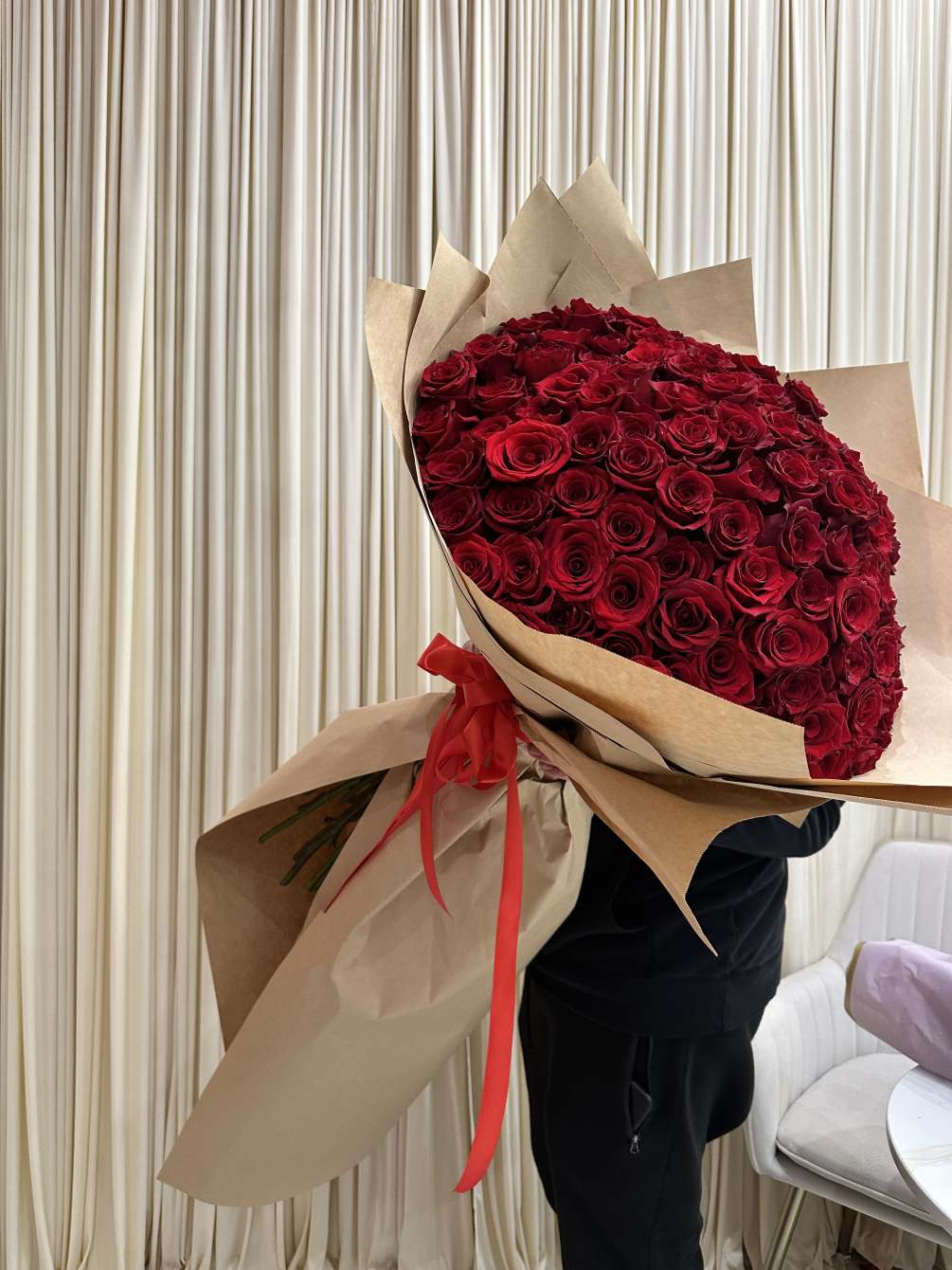 Wrapped in a cascading dress style, this dramatic bouquet of 150 