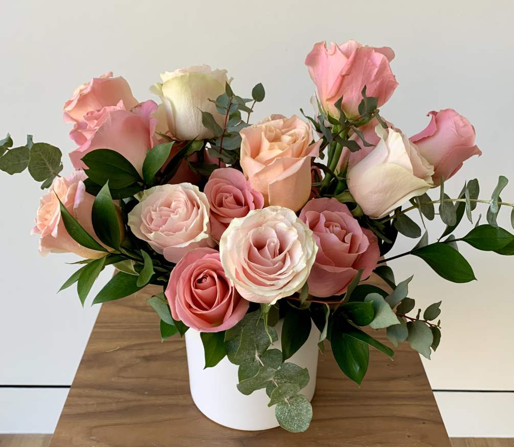A lovely arrangement of 20 stems of pinky peach roses and greenery