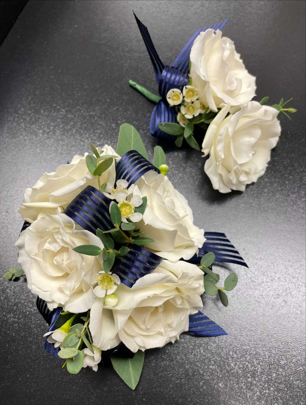Navy Blue and White Corsage and Boutonniere by A Precious Petals Florist