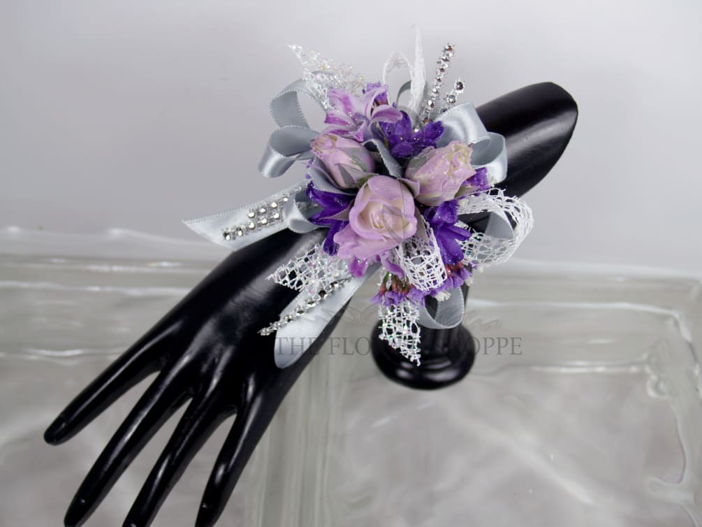 Lavendar Spray roses with purple blossoms, with a touch of Silver accents/Bling.