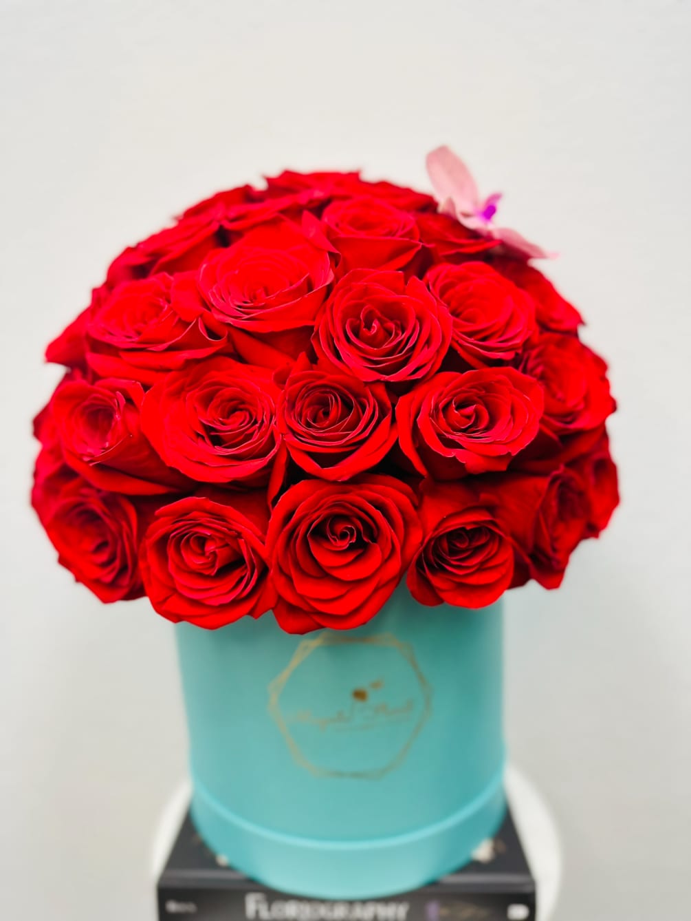 A tiffany box arrangement with 40 - 50 red Ecuadorian roses and