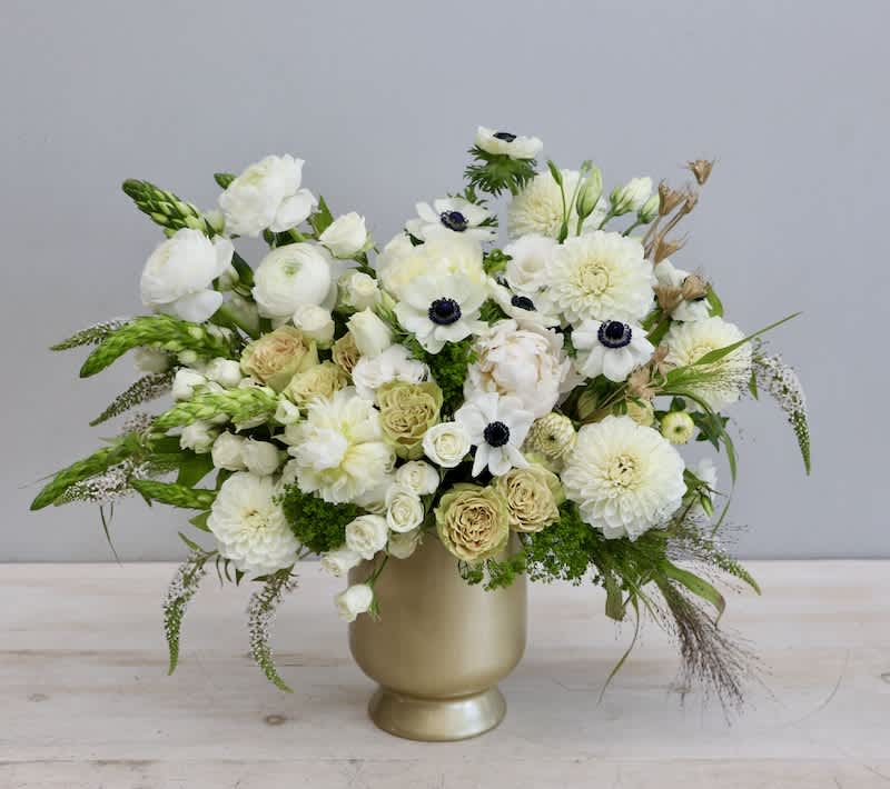 This arrangment shows off white florals in all shapes and sizes in