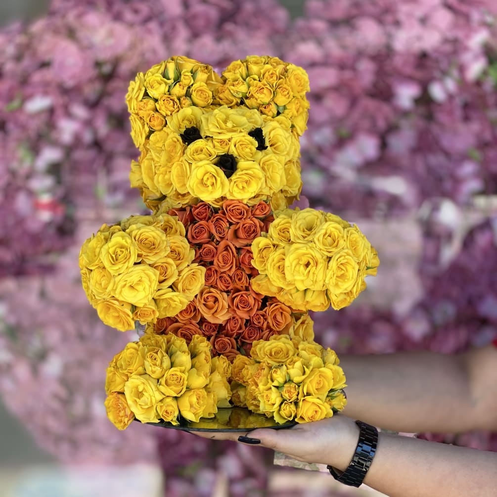 This little guys is made with yellow and orange baby roses. 