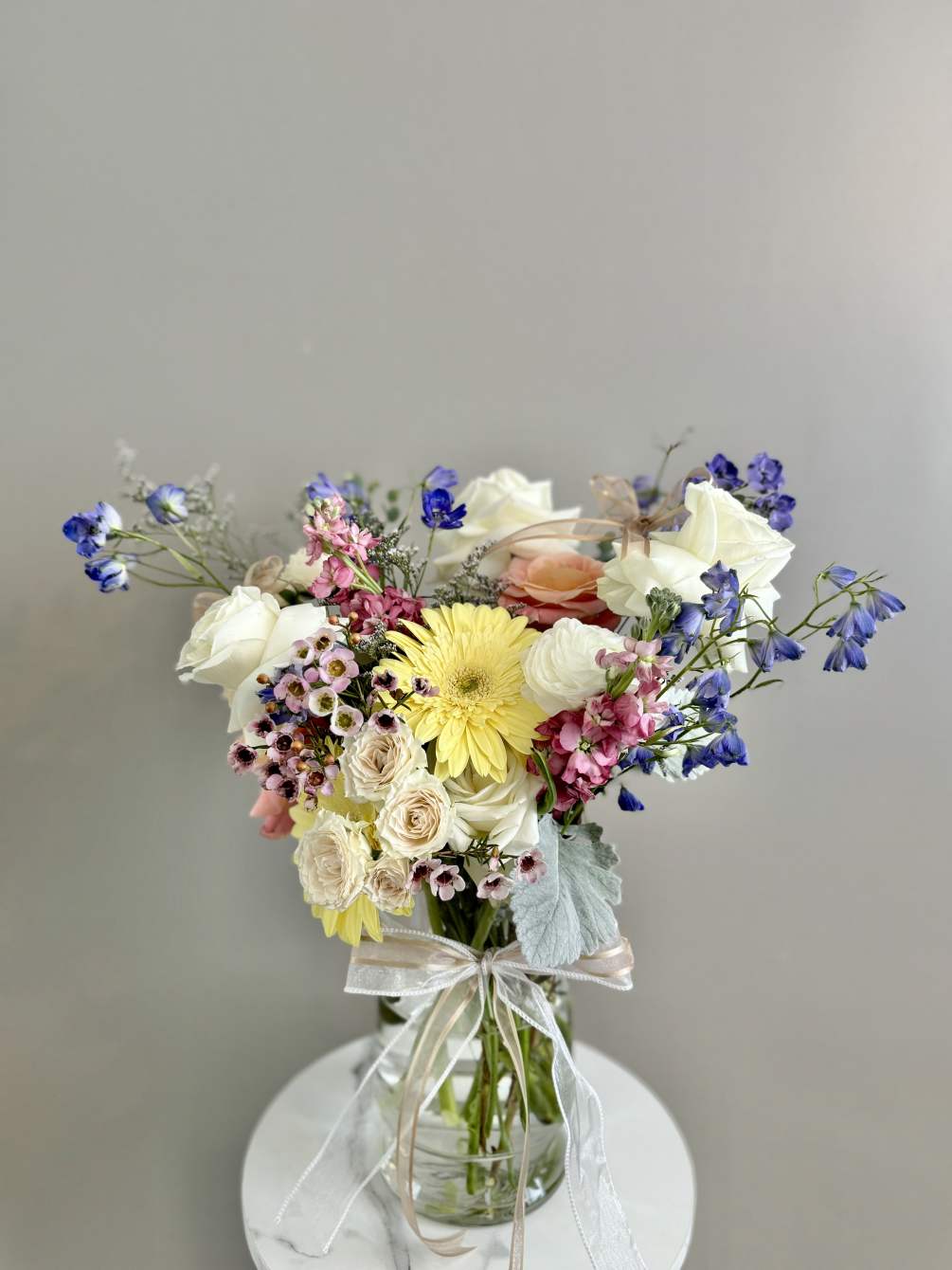 Flowers, Color, and Style chosen by the Florist. These arrangements are a