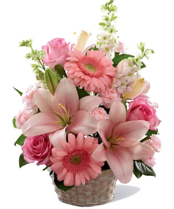 A basket busting with pink and white. The combination of roses, lilies