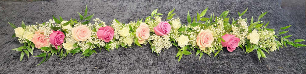 A garland of pastel roses and fillers to incorporate inside of the