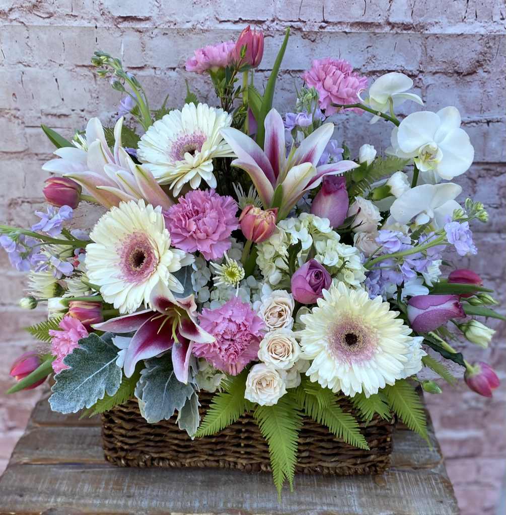 A beautiful assortment of Tulips, Orchids, Stargazer Lilies, and Gerbera Daisies in