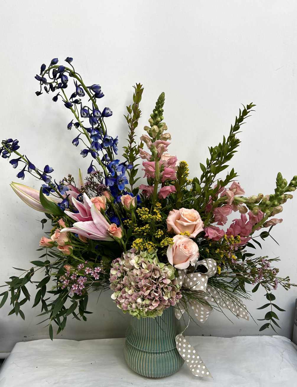 A grand design that feature roses, hydrangea, stargazer lilies and so much