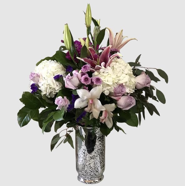 Petite purple roses with a mix of lavender florals and lillies and