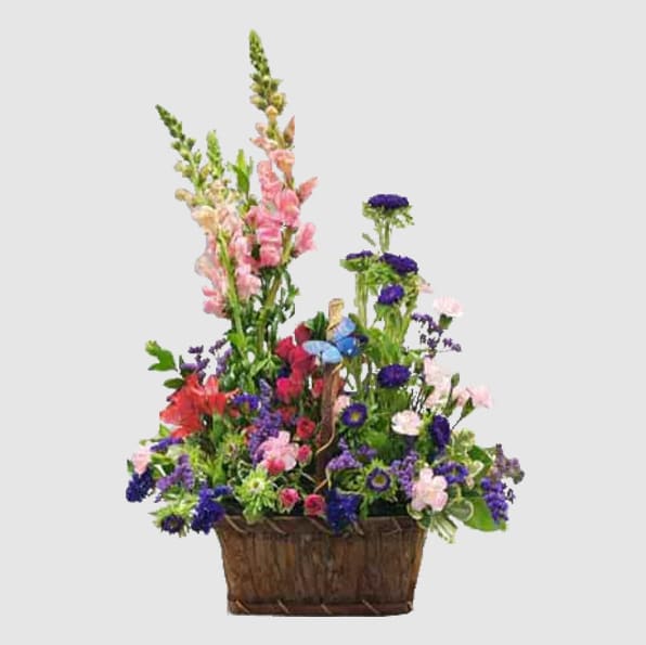 The Butterfly Garden consists of a basket filled with colorful flowers. We&rsquo;ve