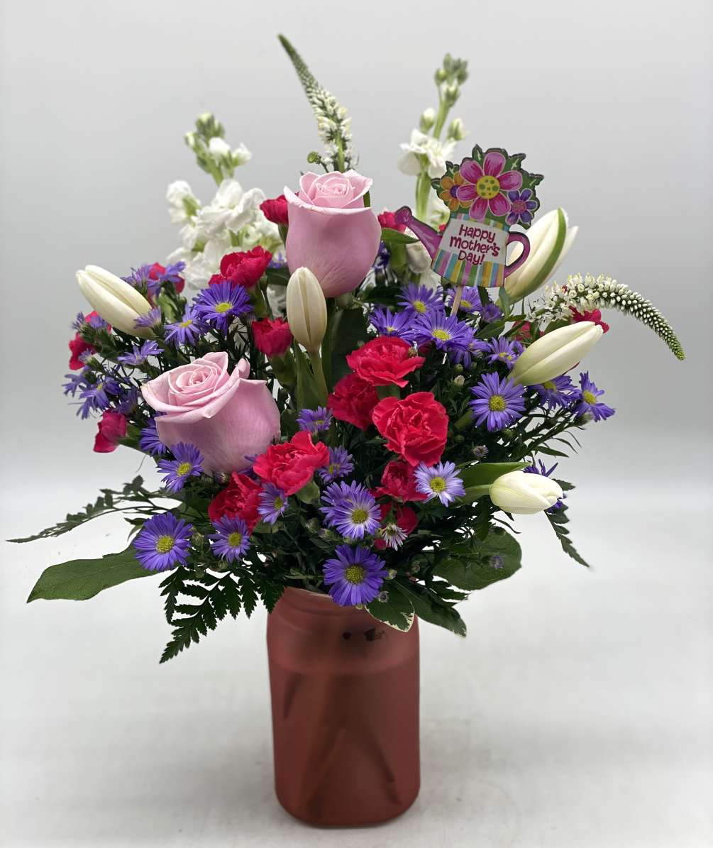 A nice mix of fresh blooms for mom designed in a hammered