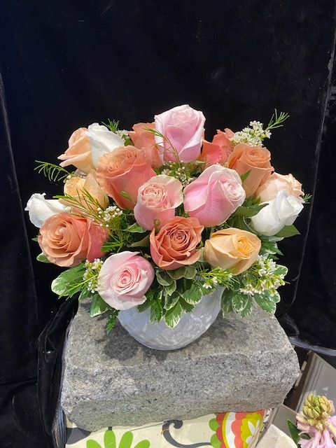 Three lovely colors of roses in light tones join together to bring