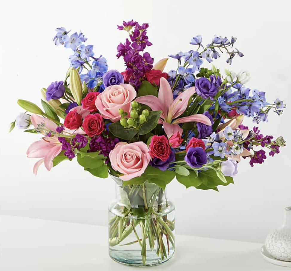 A lush bouquet of seasonal blooms ready to be delivered to your