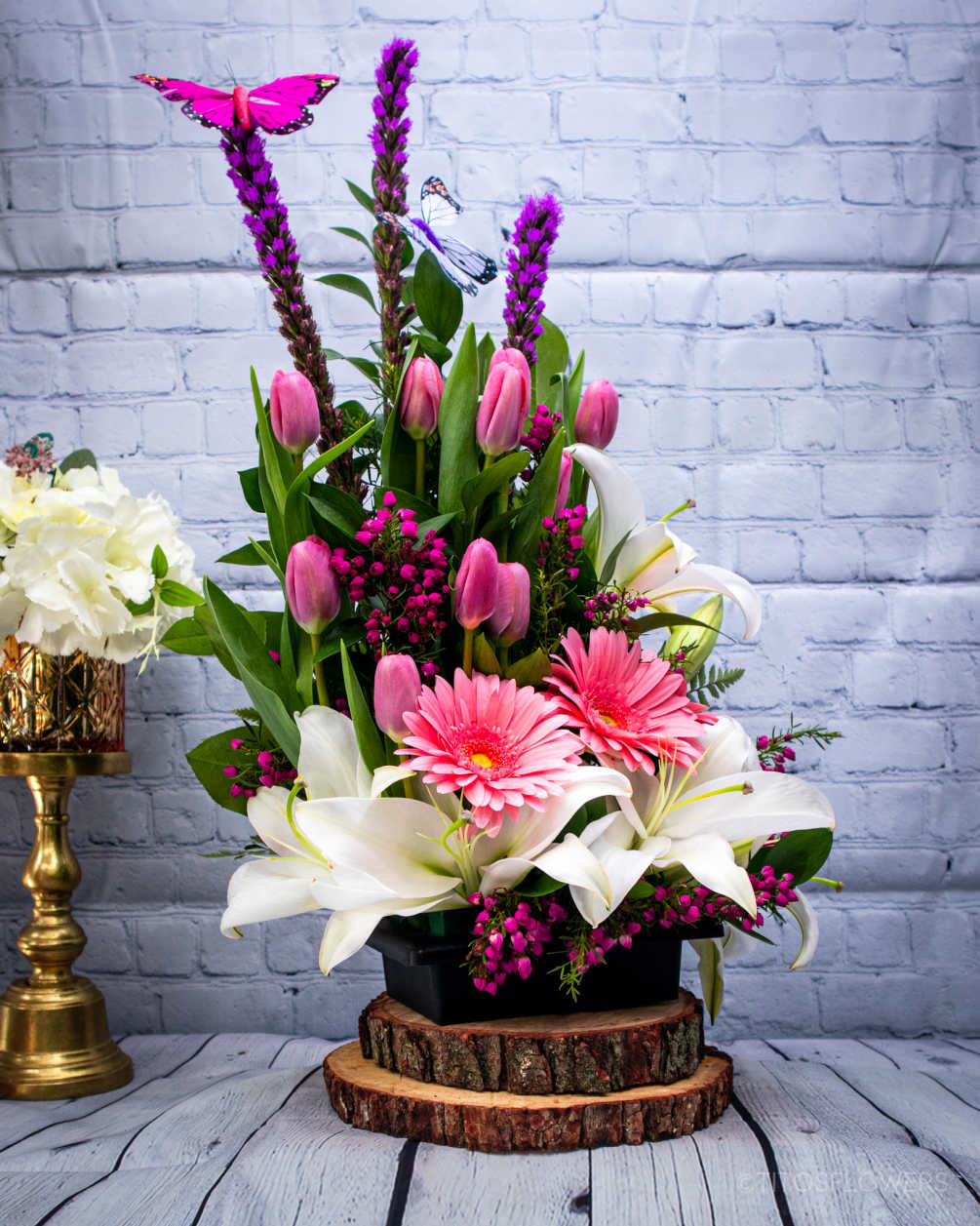 &quot;Our stunning arrangement features blush pink tulips, vibrant purple liatris, delicate pink