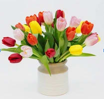 Gorgeous colorful tulips in a ceramic container. 

Bright, fresh and fun. This