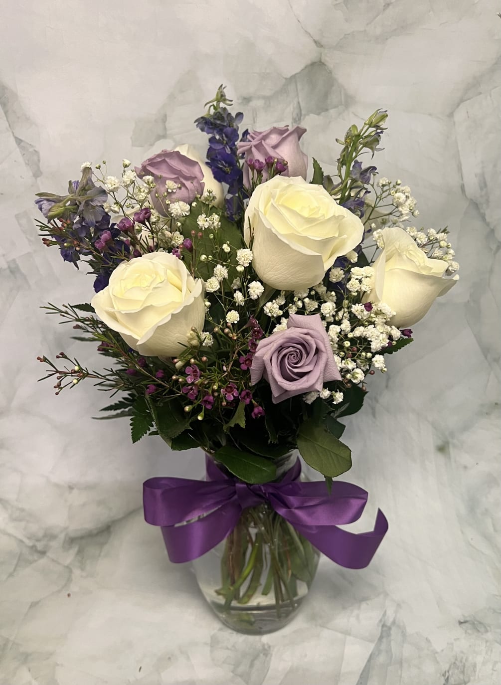 This lavender white arrangement is perfect for all occasions. Whether it is