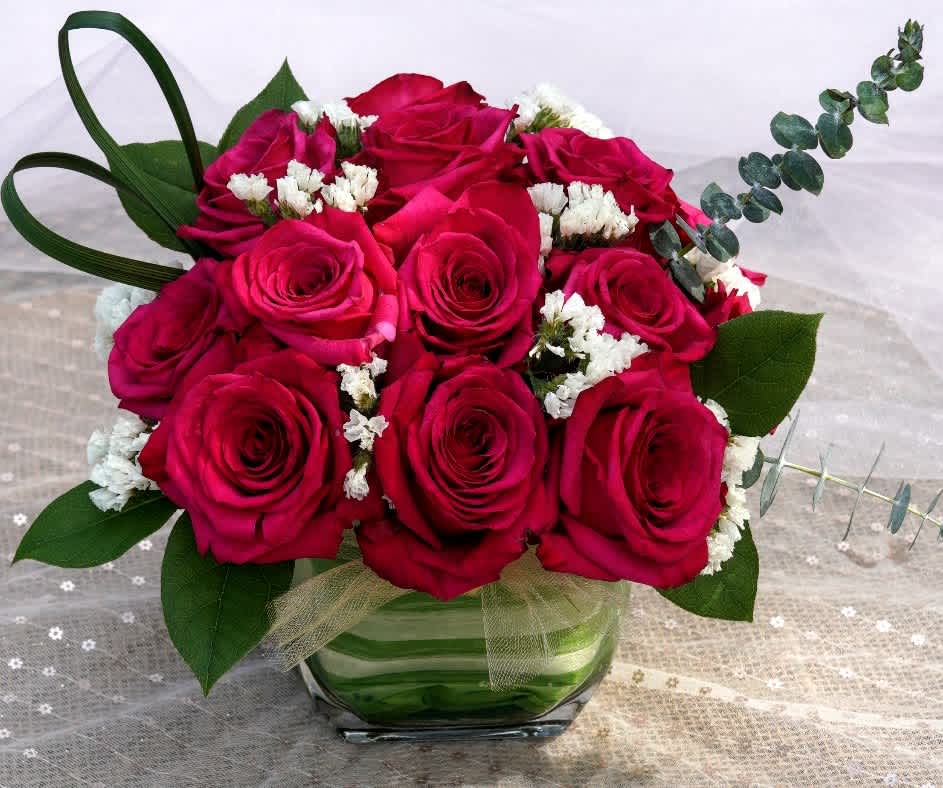 Check out these 16 magnificent hot pink roses artfully arranged modern style.