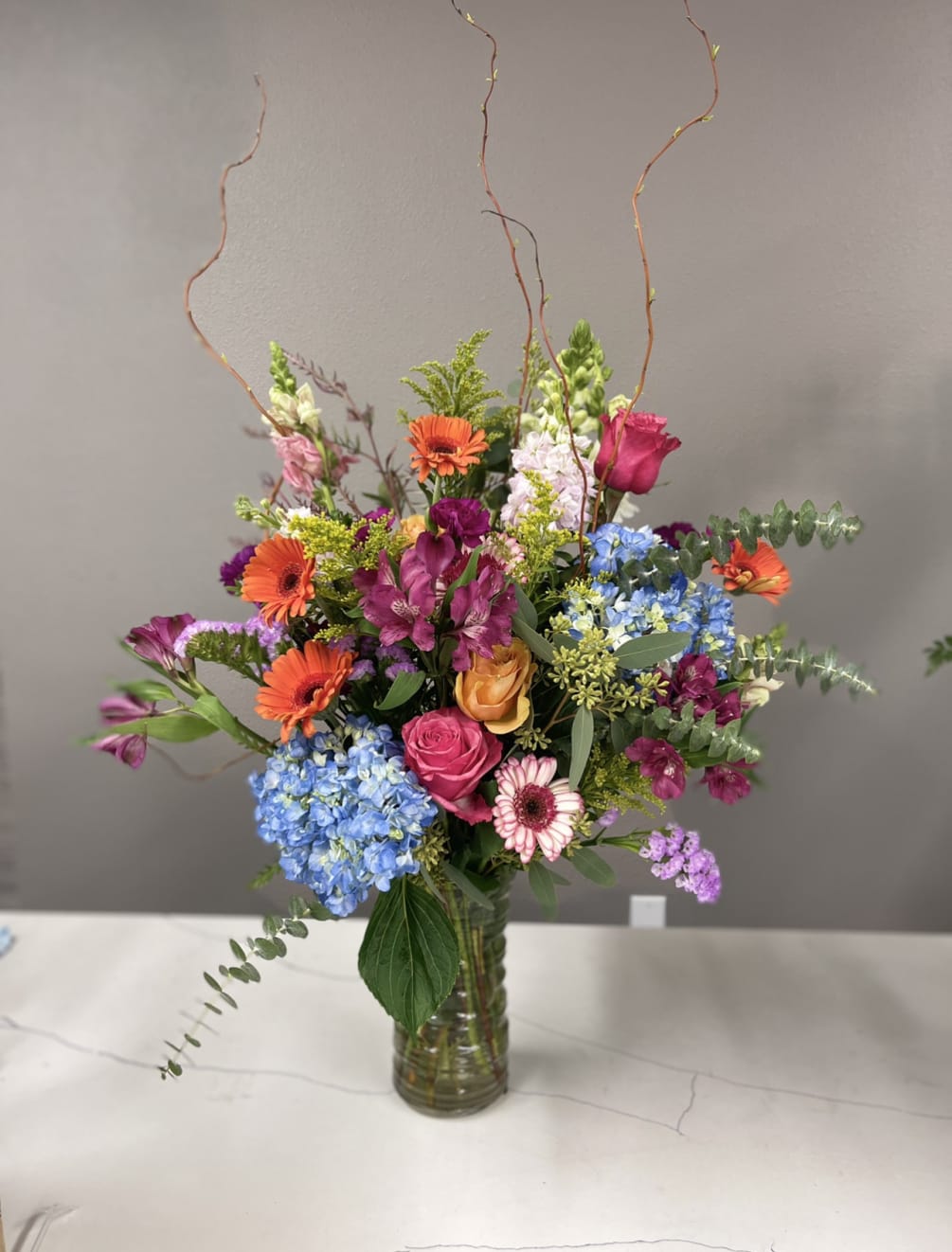MAKE THEIR DAY WITH THIS BRIGHT AND VIBRANT COLLECTION OF FLOWERS BEAUTIFULLY