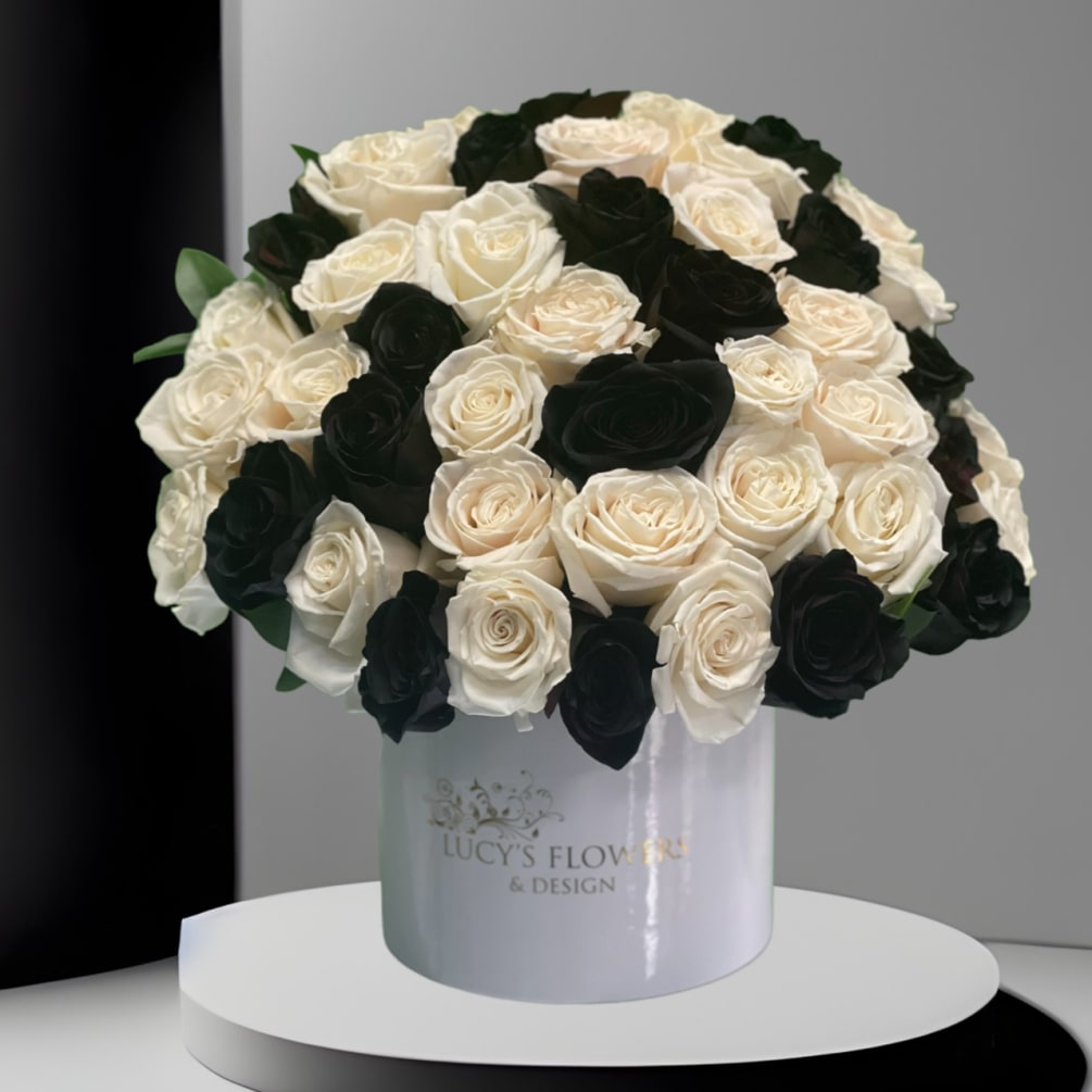 Black and white roses designed uniquely in a signature box that speaks
