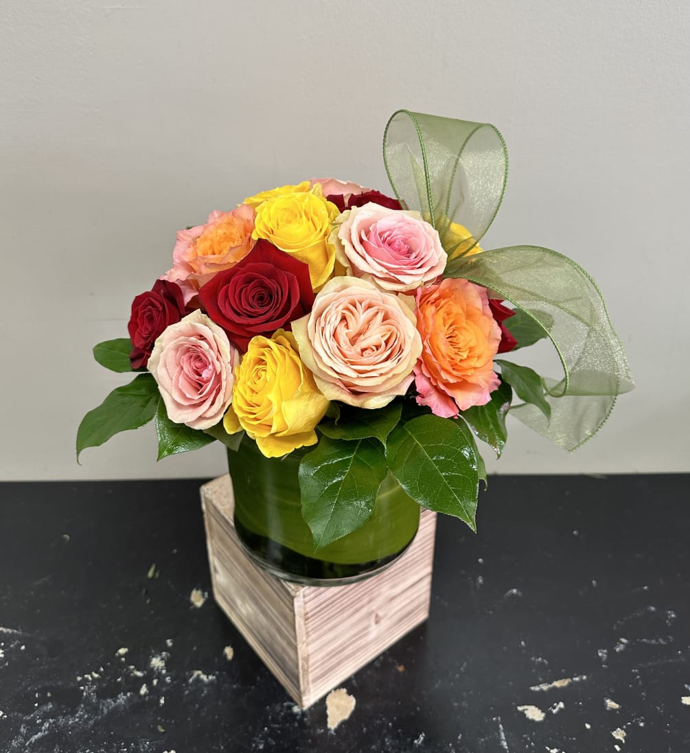 A beautiful, warm-toned mix of roses built in a shorter style in