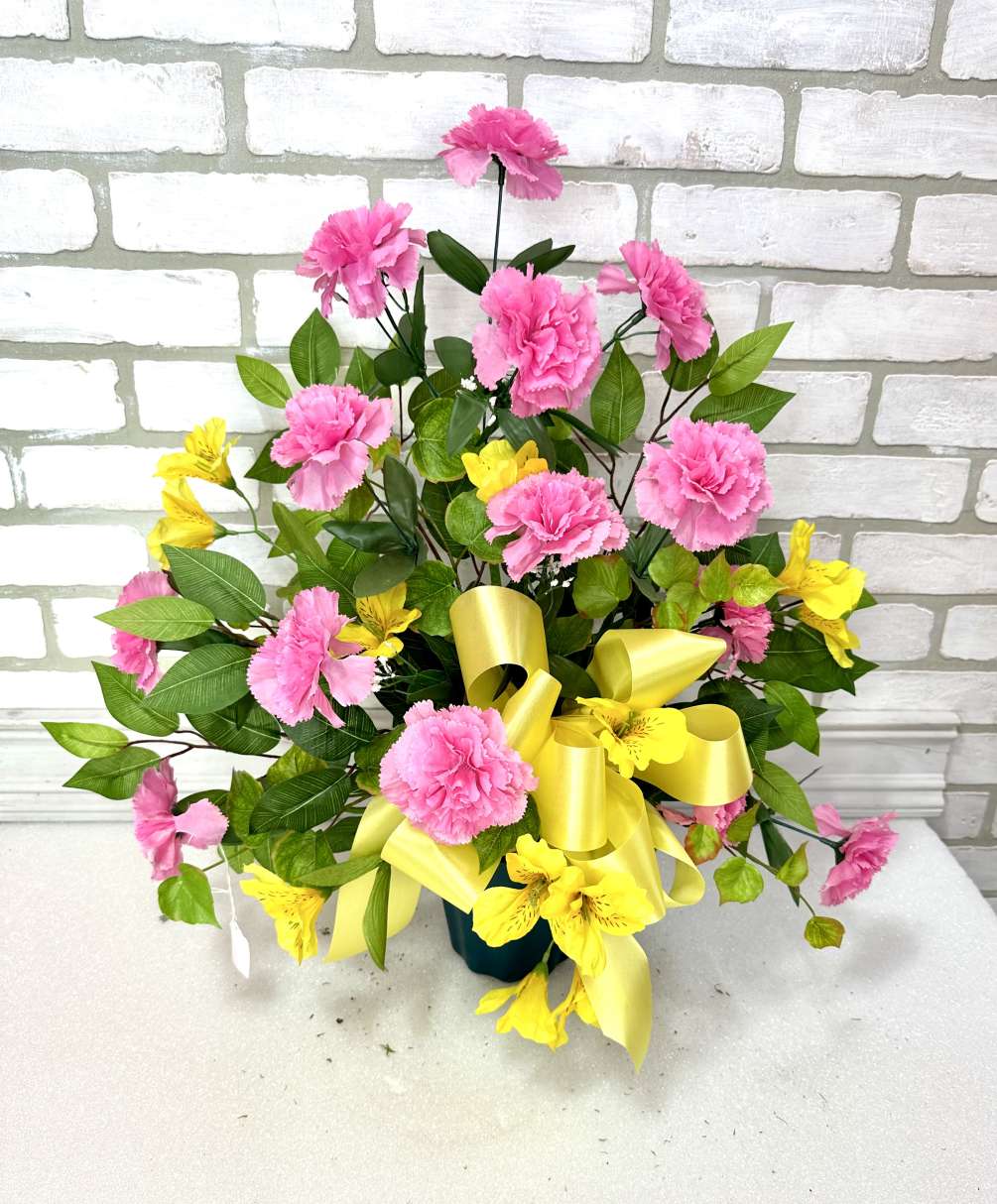 A traditional fan arrangement with silk pink carnations and yellow alstroermeria lilies.
