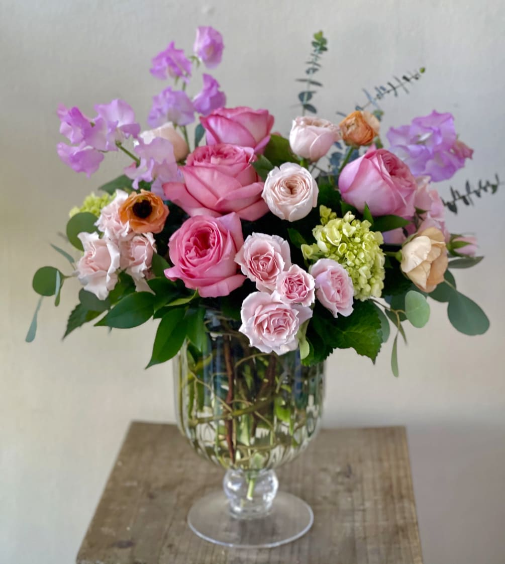 A lovely footed vase filled with garden-inspired blooms
Approximately 19&quot;H x 15&quot;W