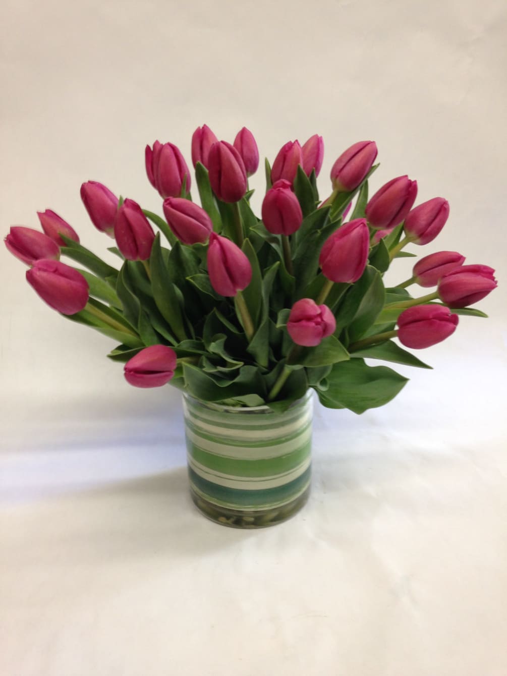 30 stems of locally grown tulips in a vase. (Some flowers may