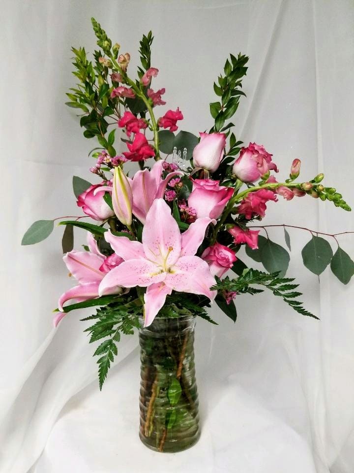 The beautiful arrangement of pink flowers is sure to please! 