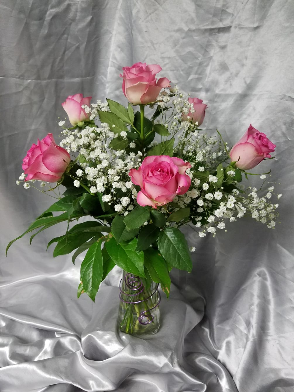 This beautiful half dozen roses puts a modern twist  on a