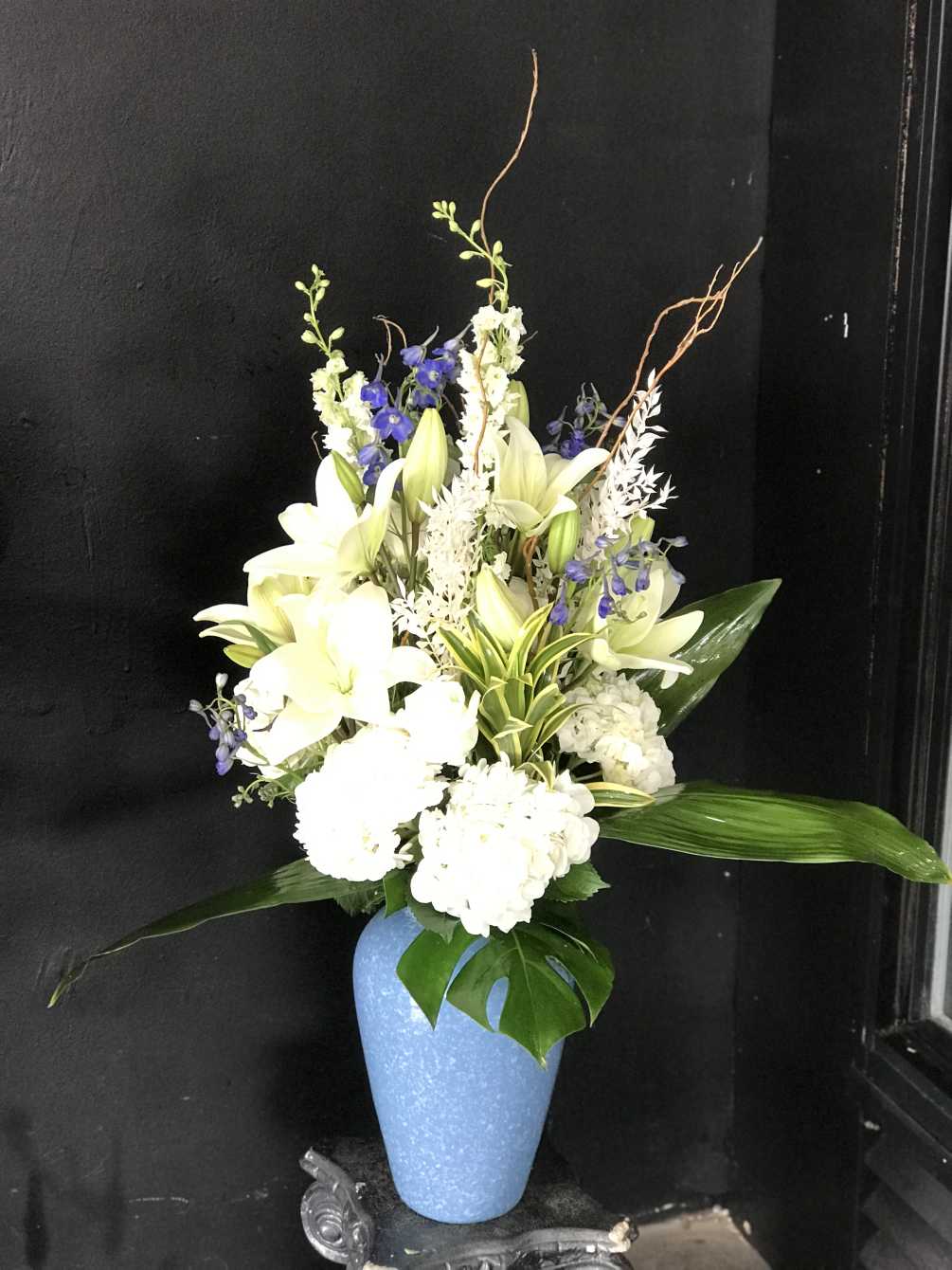 All White bouquet with a touch of blue