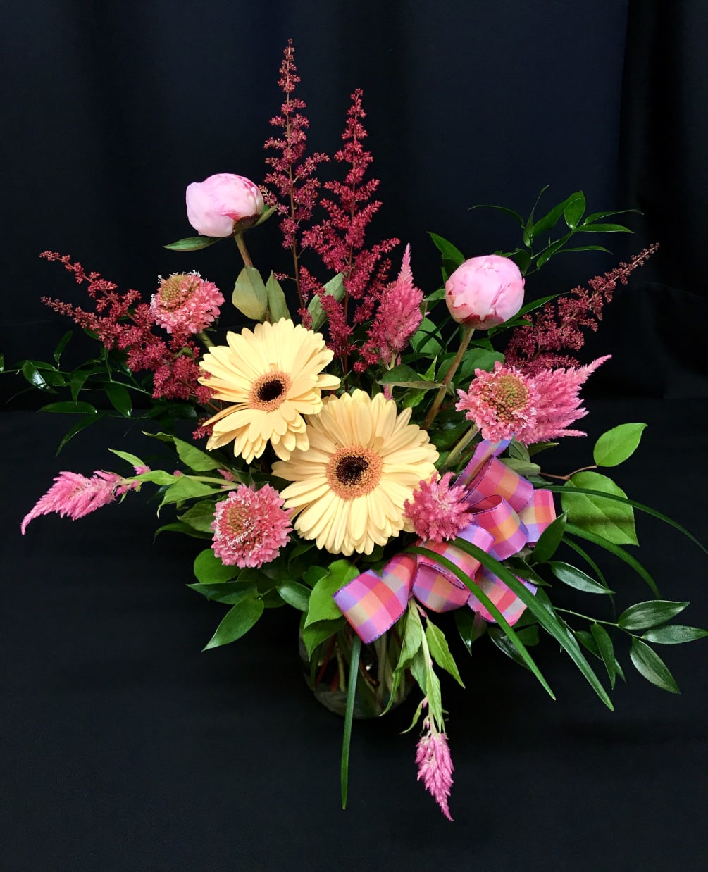 Gorgeous raspberry and pink shades, gerber daisies, peonies!!! Order a few weeks